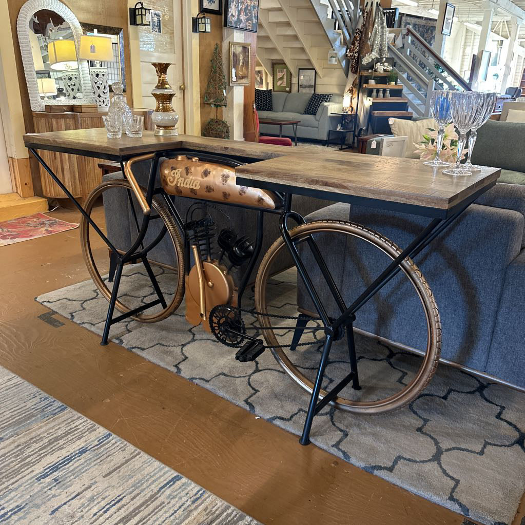 Table made from repurposed bicycle wheels in a living room setting