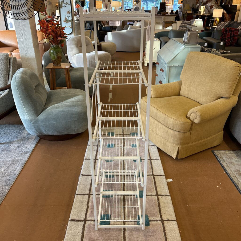 Furniture store interior with a ladder and chairs