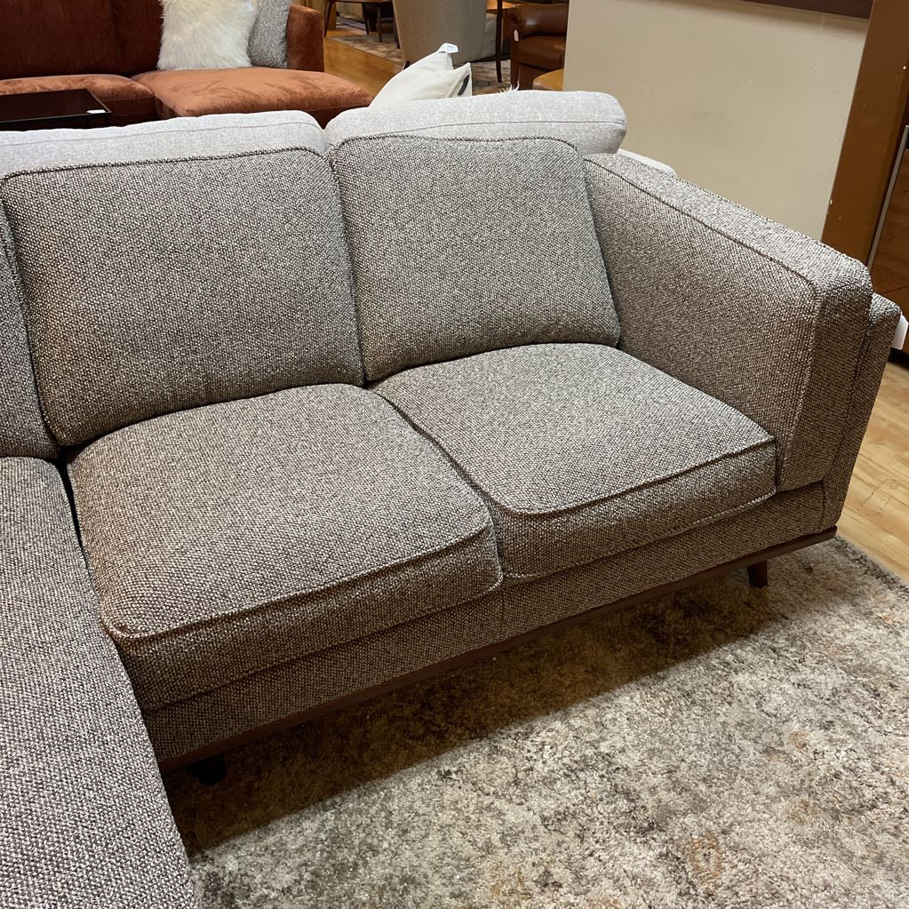 Gray textured sectional sofa in a room setting