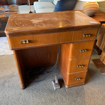 Wooden desk with drawers in a room setting