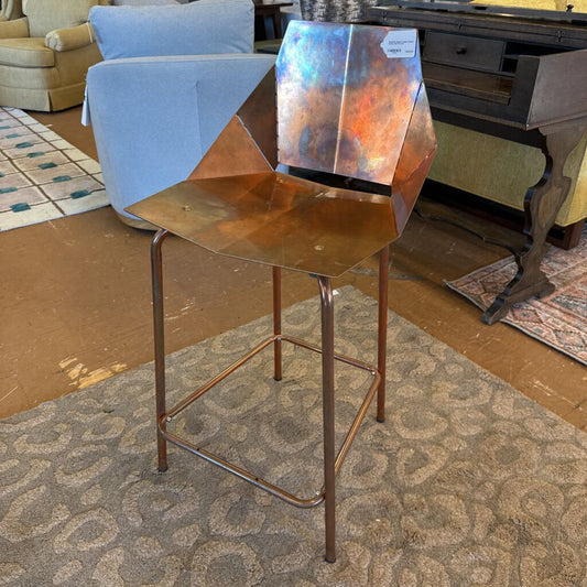 Copper bar stool in a room with furniture and decor