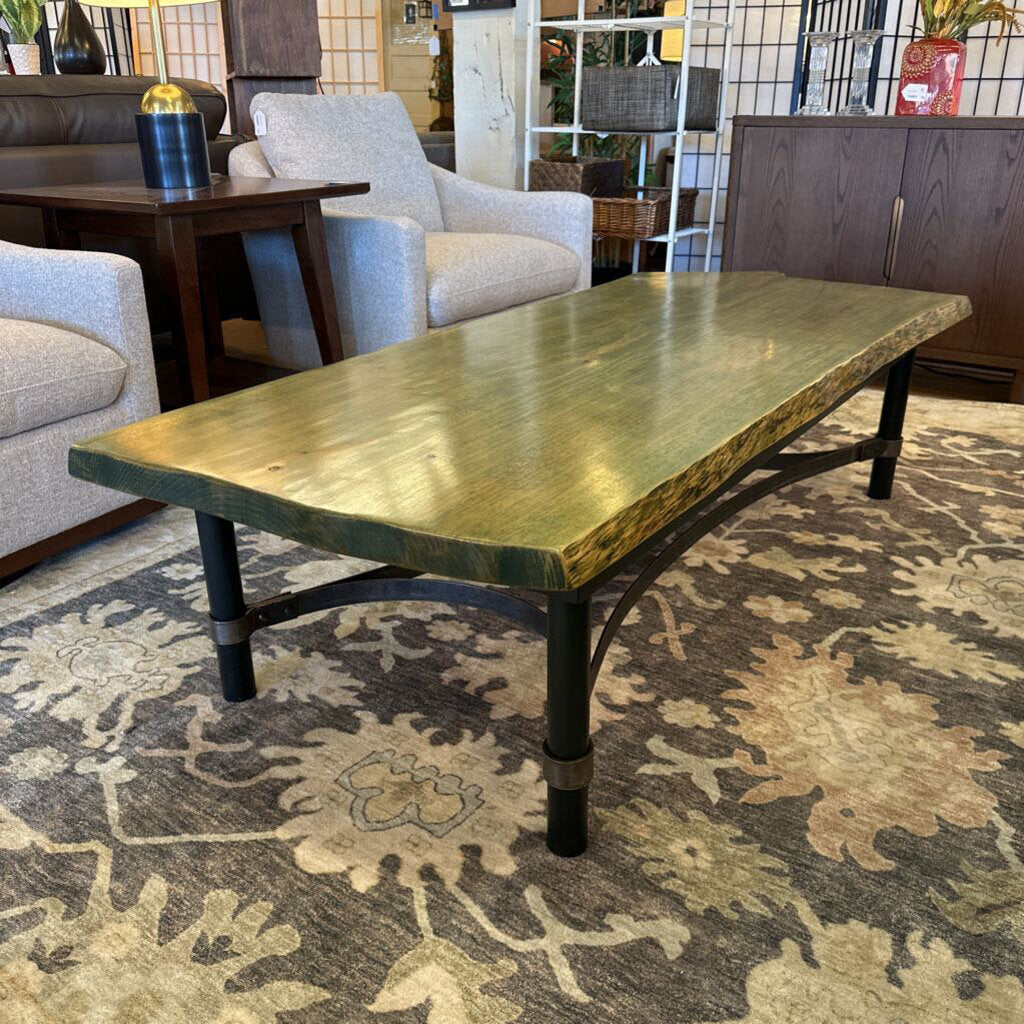 Wooden coffee table in a room with furniture and decor