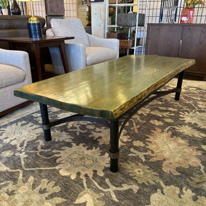 Wooden coffee table in a room with furniture and decor