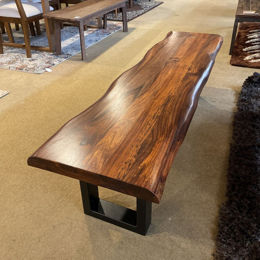 Wooden bench with a natural finish in an indoor setting