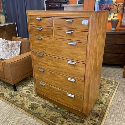 Wooden dresser with multiple drawers in a room setting