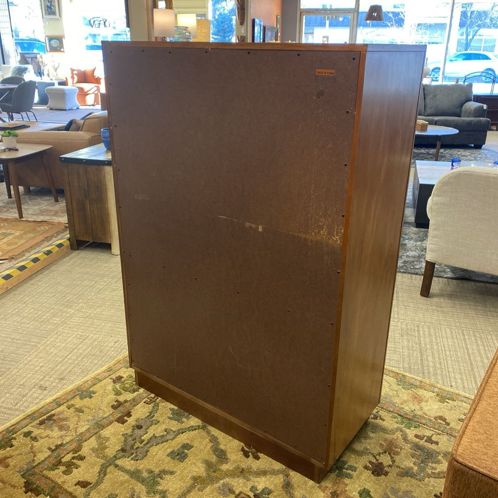 Large wooden speaker in a room with furniture and decor