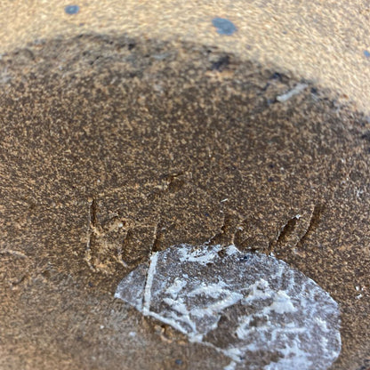 Crushed glass on sandy surface