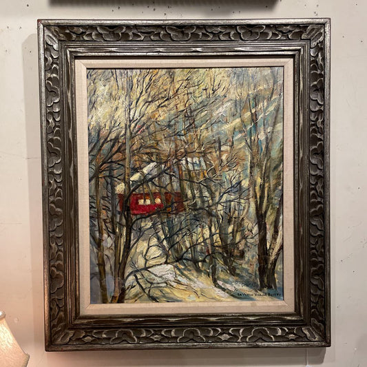 Framed artwork of a red house in a winter forest scene.