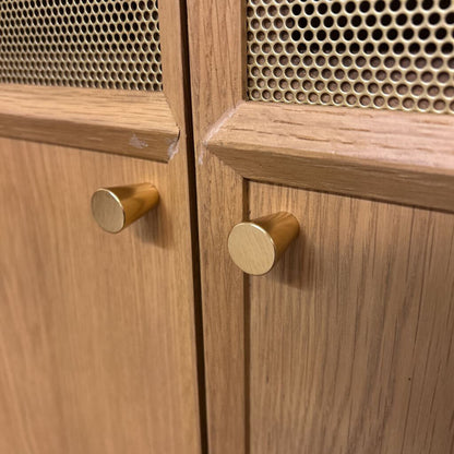 Wooden cabinet with gold knobs