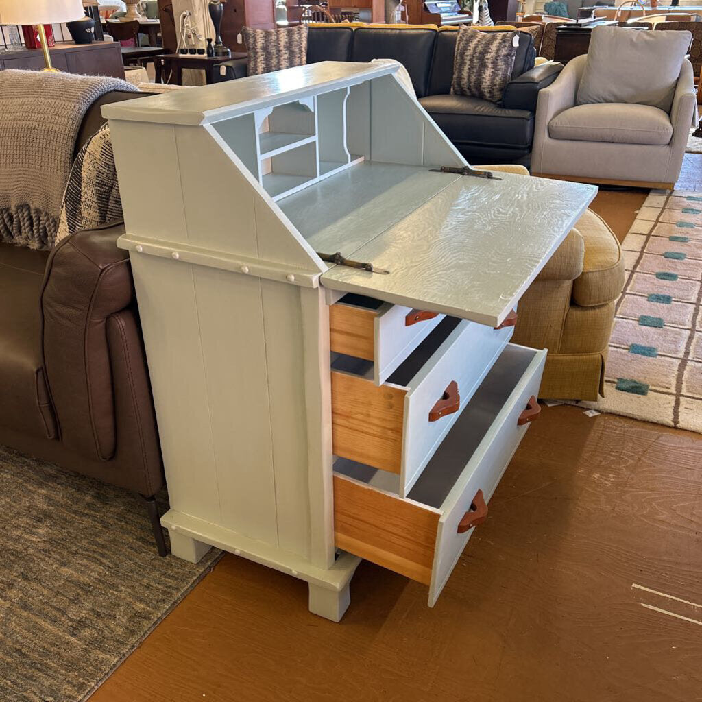 Foldable table with storage drawers in a living room setting