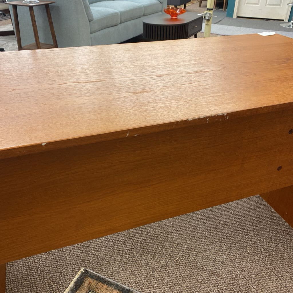 Wooden surface with a blurred background of a living room.