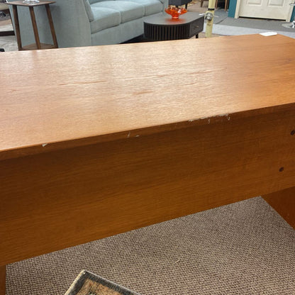 Wooden surface with a blurred background of a living room.