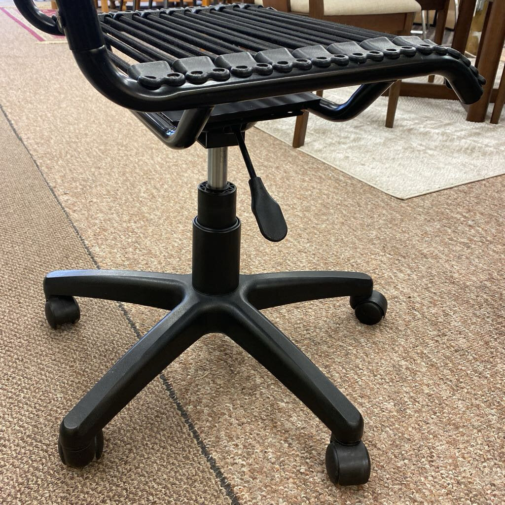 Black office chair on a carpeted floor
