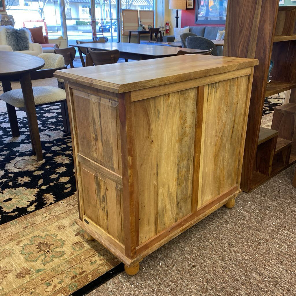 Wooden cabinet in a room with furniture and decor