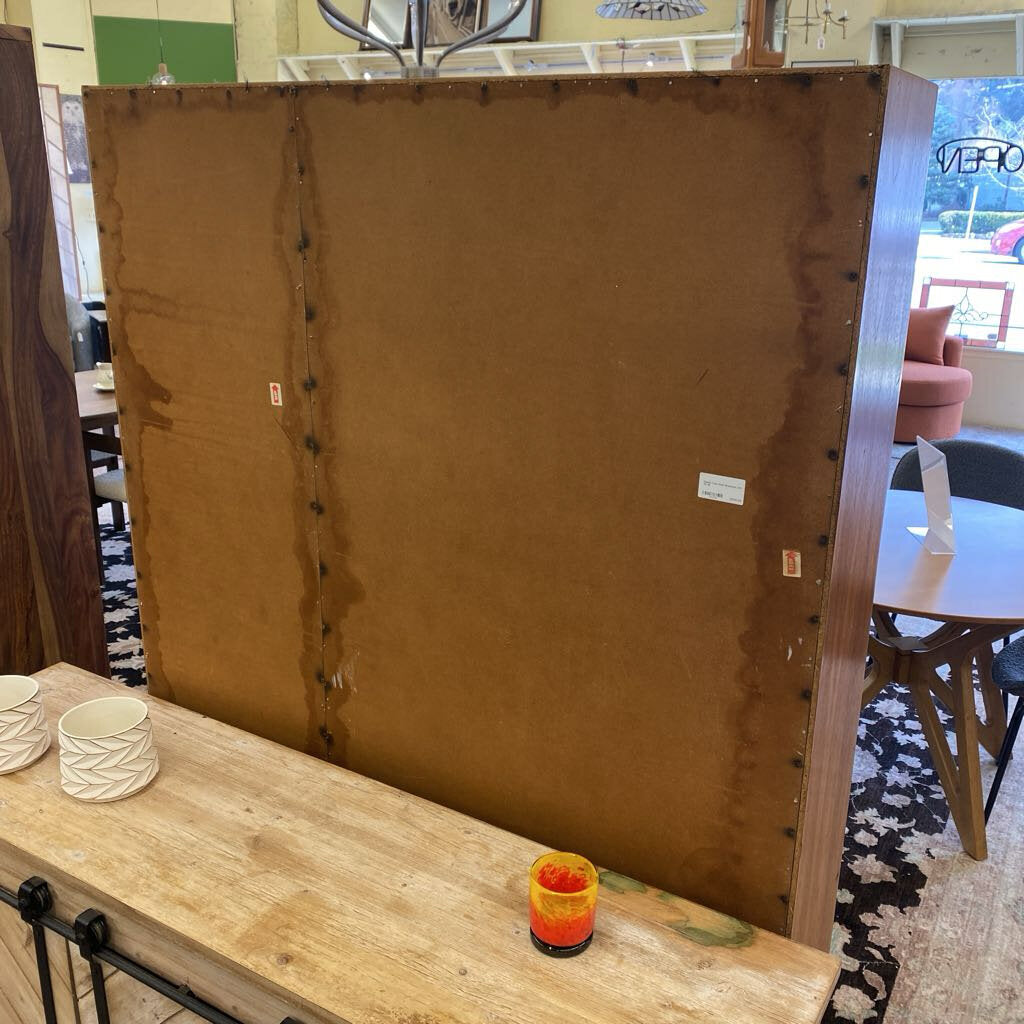 Large brown board with visible wear on a wooden surface