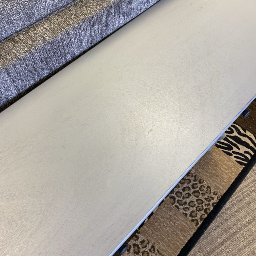 Close-up of various textured carpet samples including plain beige, patterned brown, and striped blue.