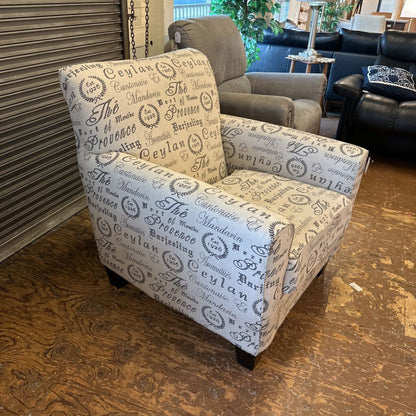 Patterned armchair in a room with other furniture