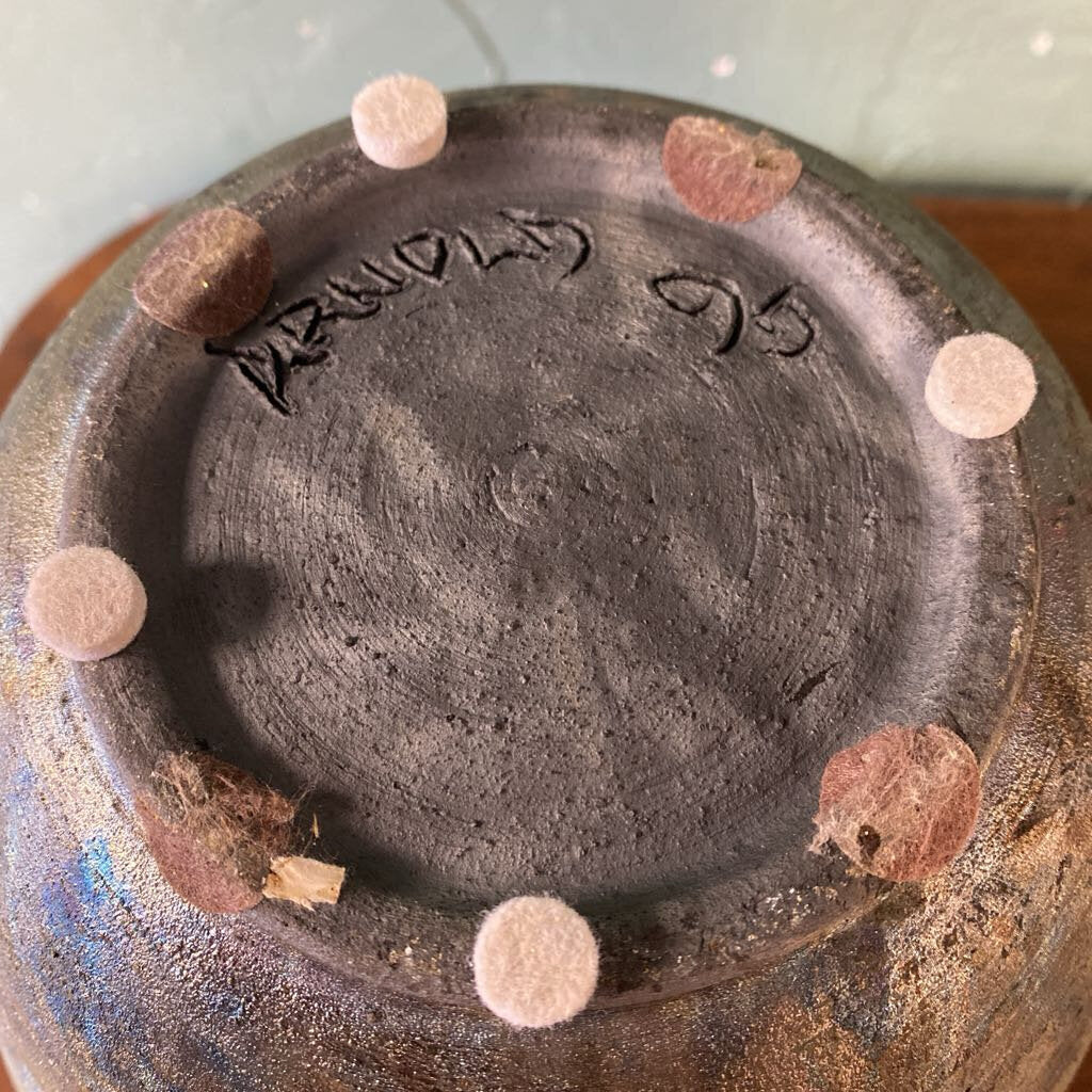 Ceramic pot with a signature on the base