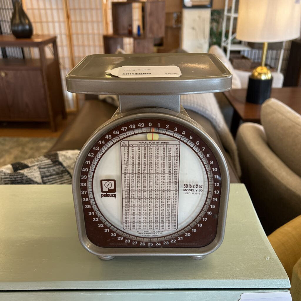 Vintage kitchen scale on a table with a home interior background