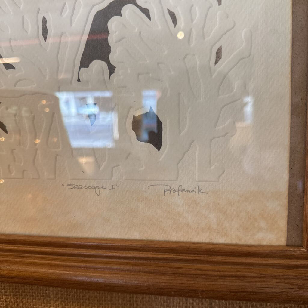 Framed artwork with a decorative glass panel