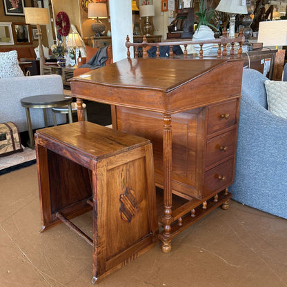Wooden desk with a smaller wooden table in a furniture store setting