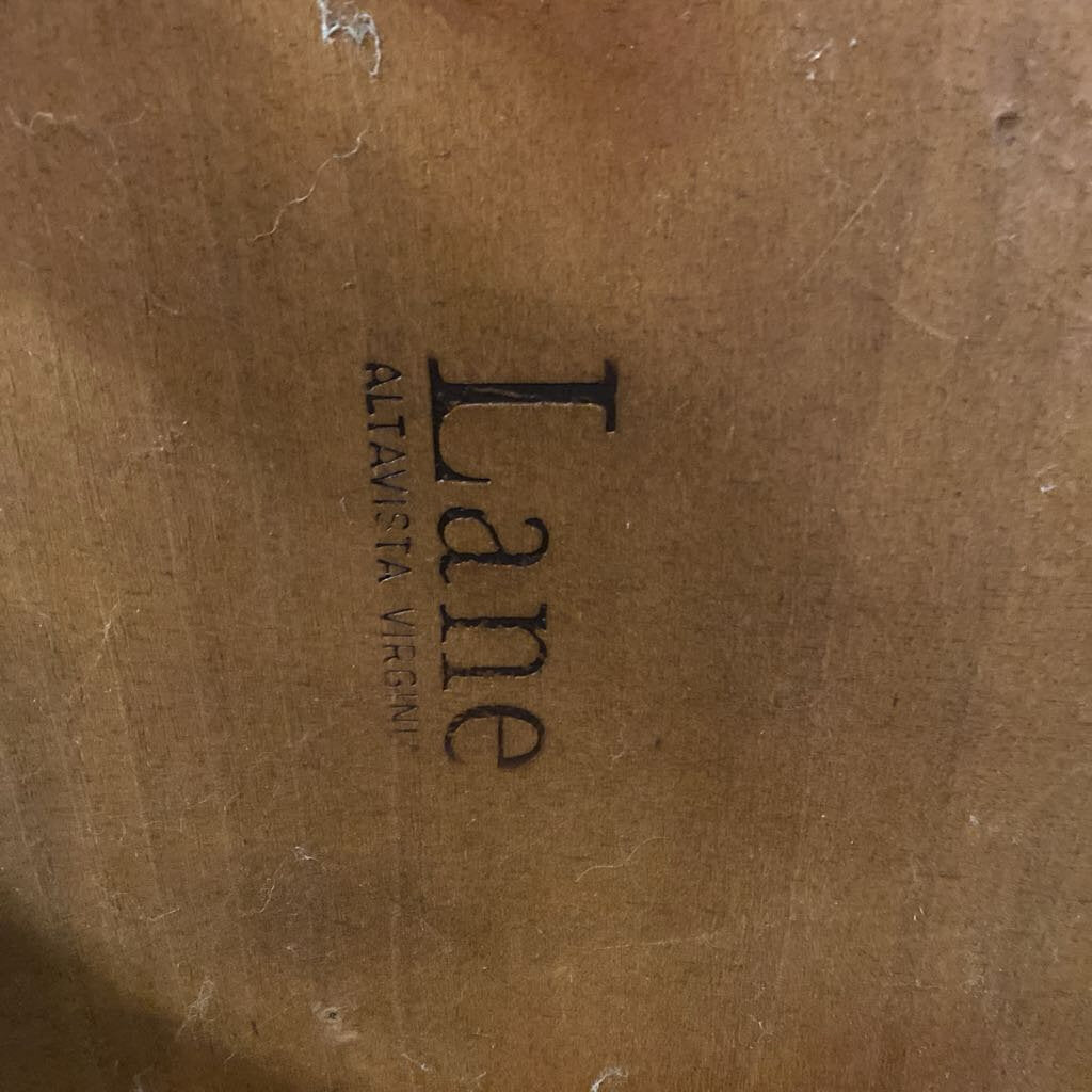 Brown leather surface with 'Lane' branding