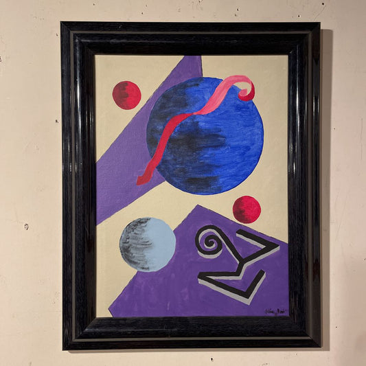 Abstract art piece with geometric shapes and a black frame on a beige wall.