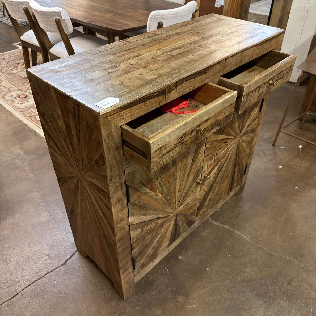 Wooden sideboard with geometric pattern on a concrete floor