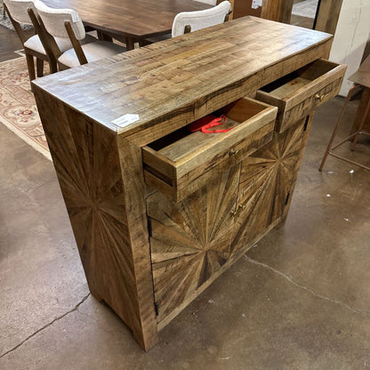 Wooden sideboard with geometric pattern on a concrete floor