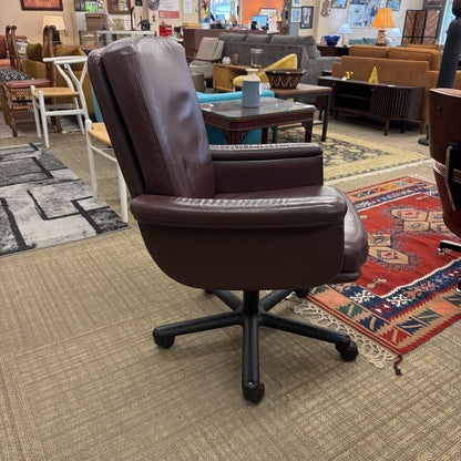 Brown office chair in a room with furniture and decor