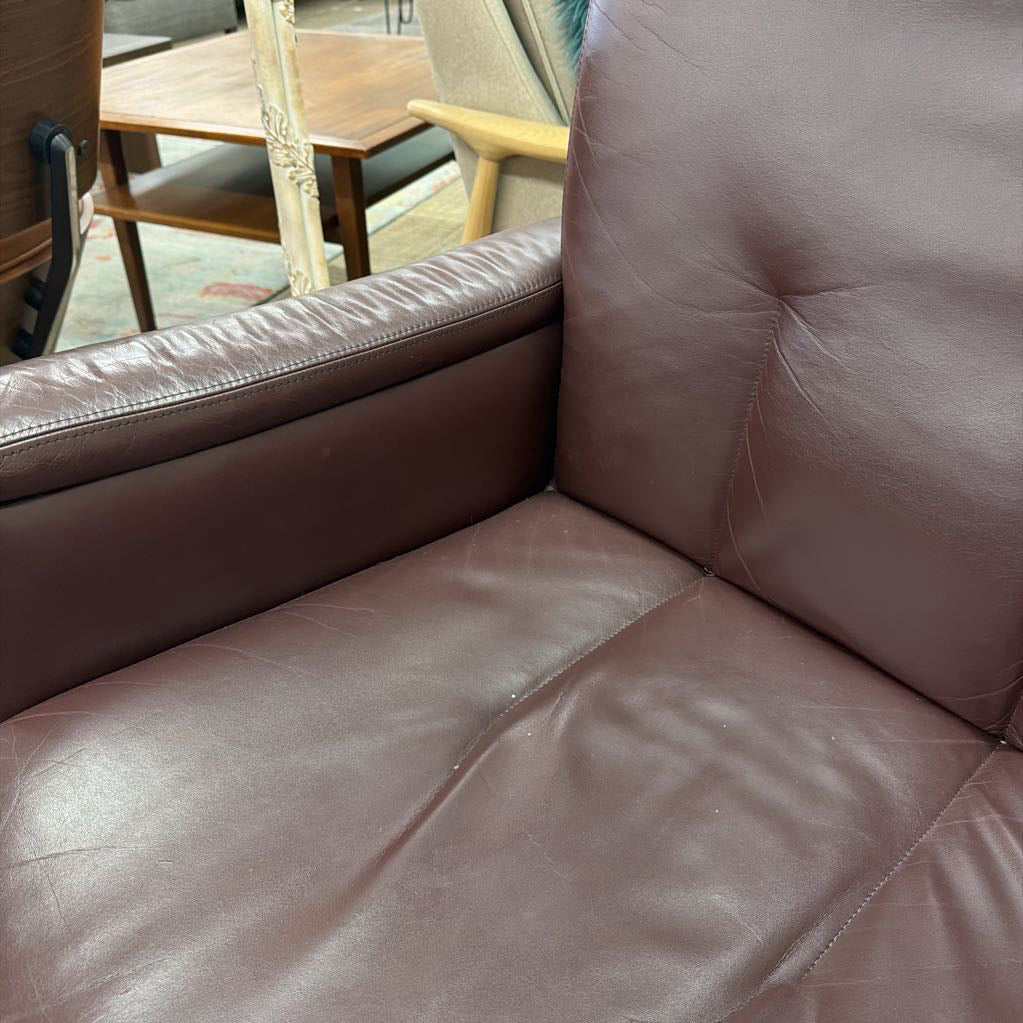 Brown leather sofa with a blurred background