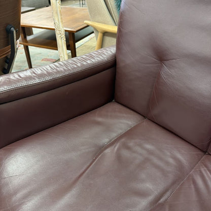 Brown leather sofa with a blurred background