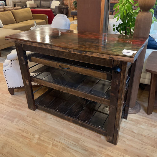 Wooden console table with metal accents in a living room setting