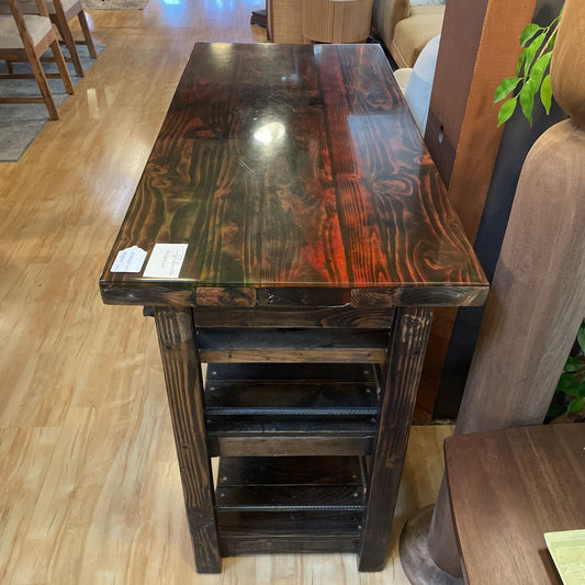 Wooden table with a dark finish on a wooden floor