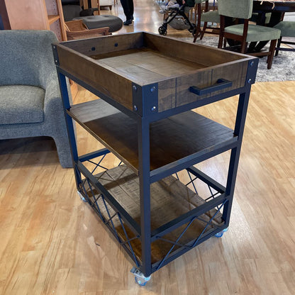 Wooden cart with blue metal frame on a wooden floor