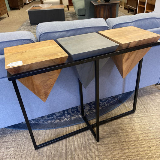 Modern console table with wooden shelves in a room setting