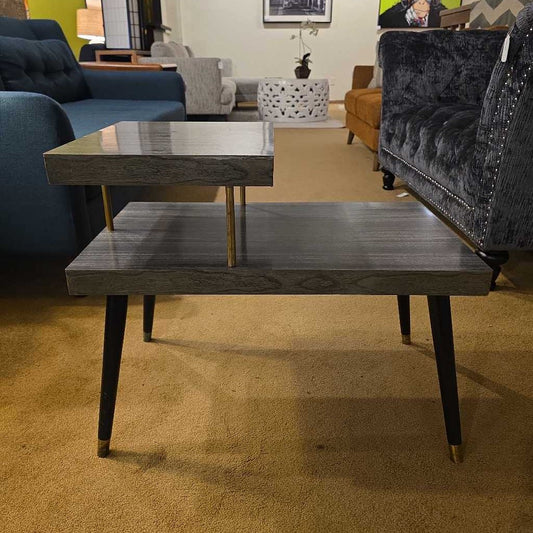 Living room with a wooden coffee table and gray sofa