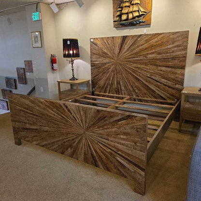 Wooden bed with starburst design in a showroom setting