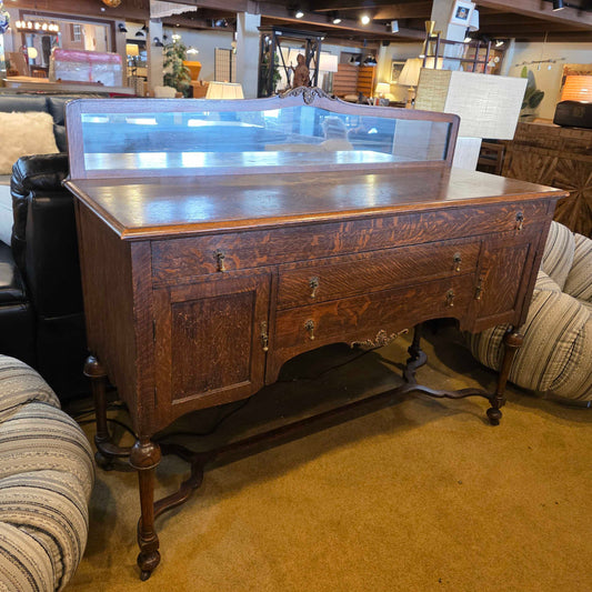 Wooden desk with glass top in a room setting