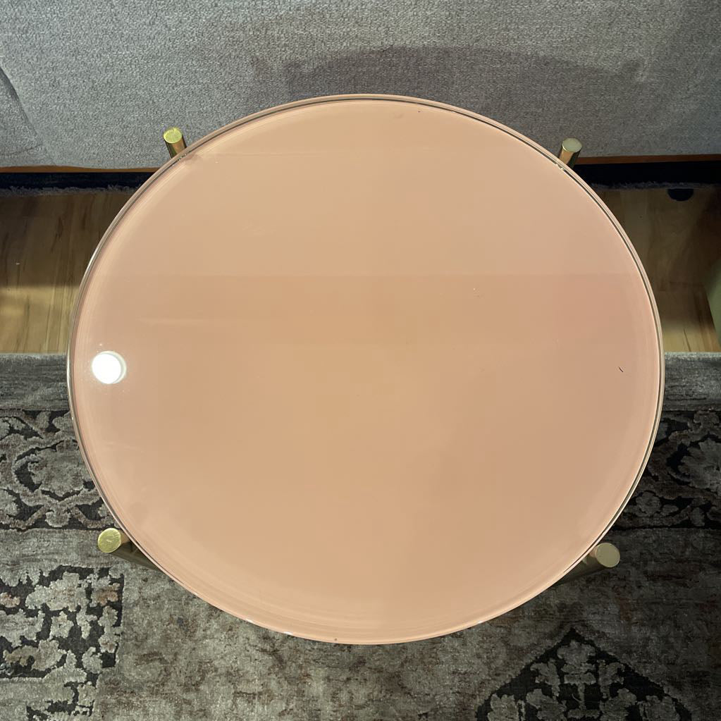 Round metallic object on a textured surface