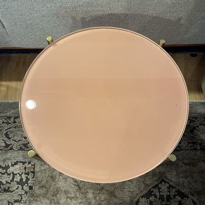 Round metallic object on a textured surface