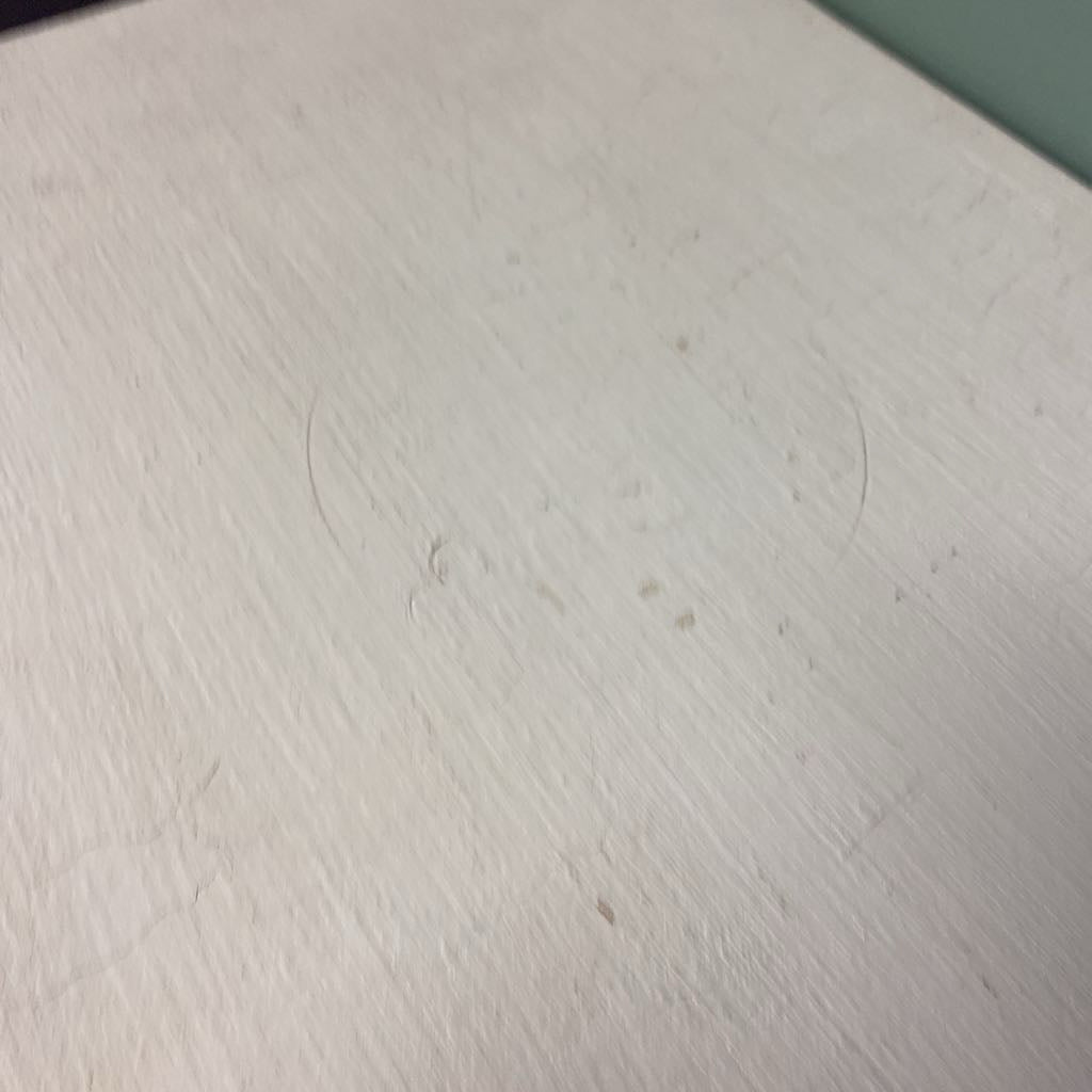 Close-up of a textured white surface with circular patterns