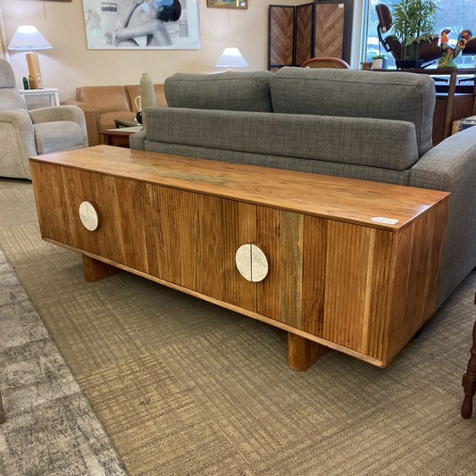 Wooden coffee table with decorative elements in a living room setting