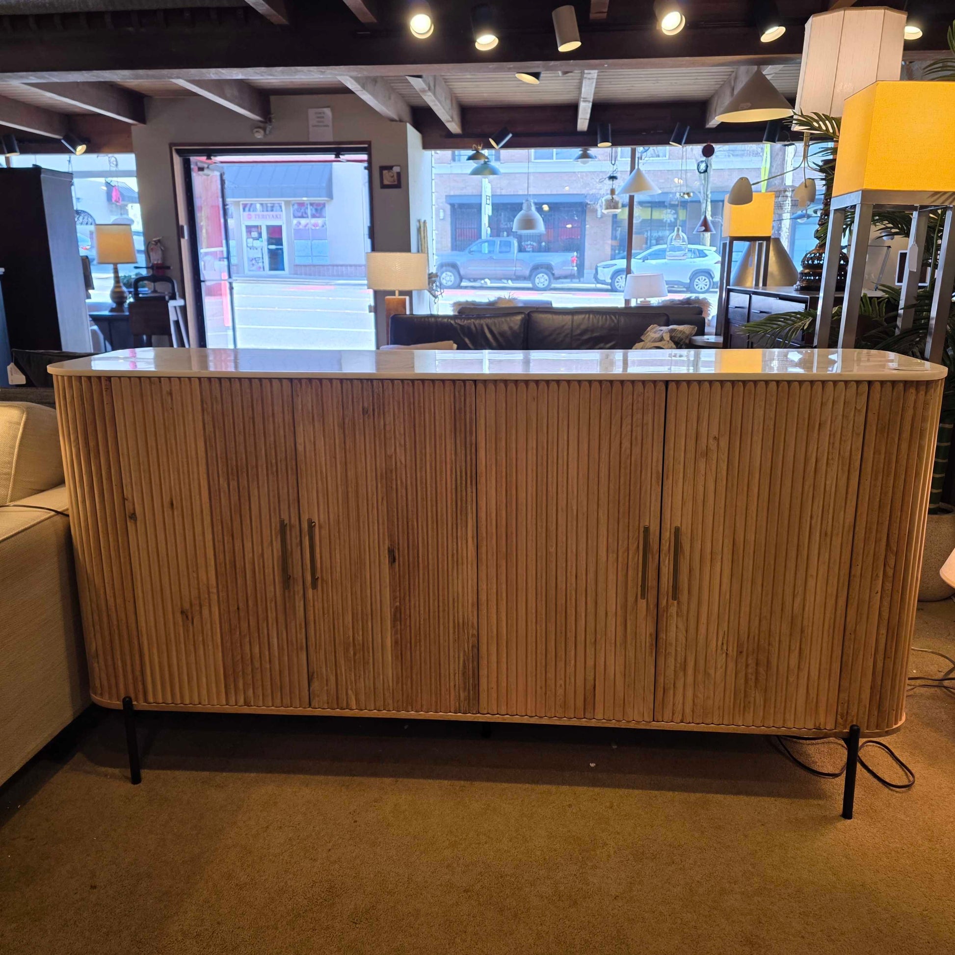 Wooden sideboard in a room with furniture and decor