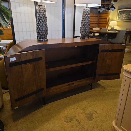 Wooden sideboard with open doors in a room setting