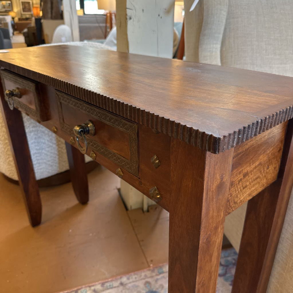 Wooden desk with drawers in a room setting