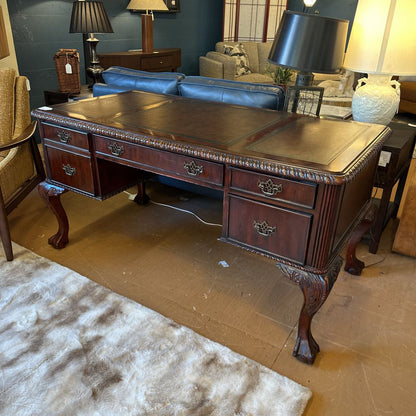 Wooden desk in a room with furniture and decor