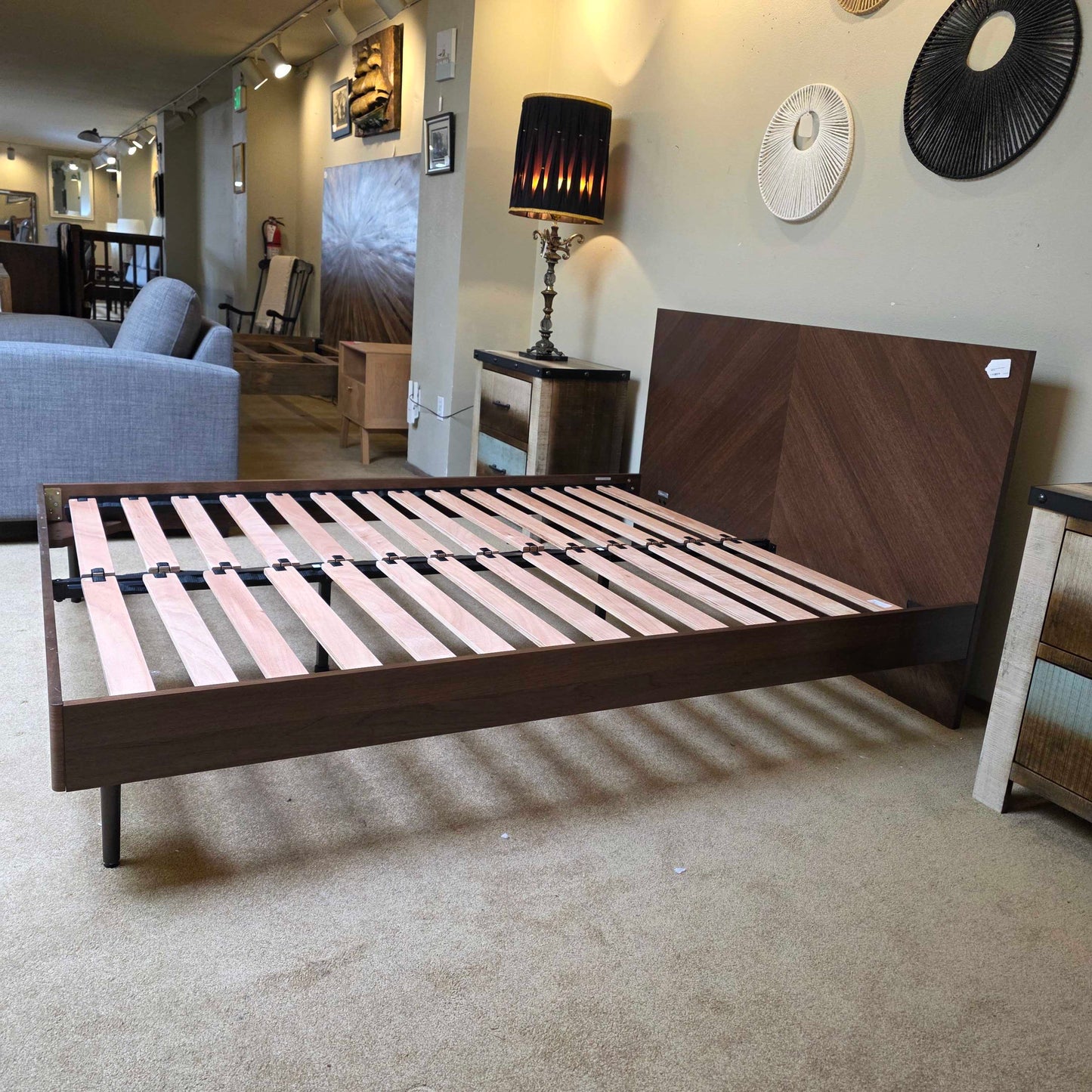 Wooden staircase with striped railing in a home interior setting