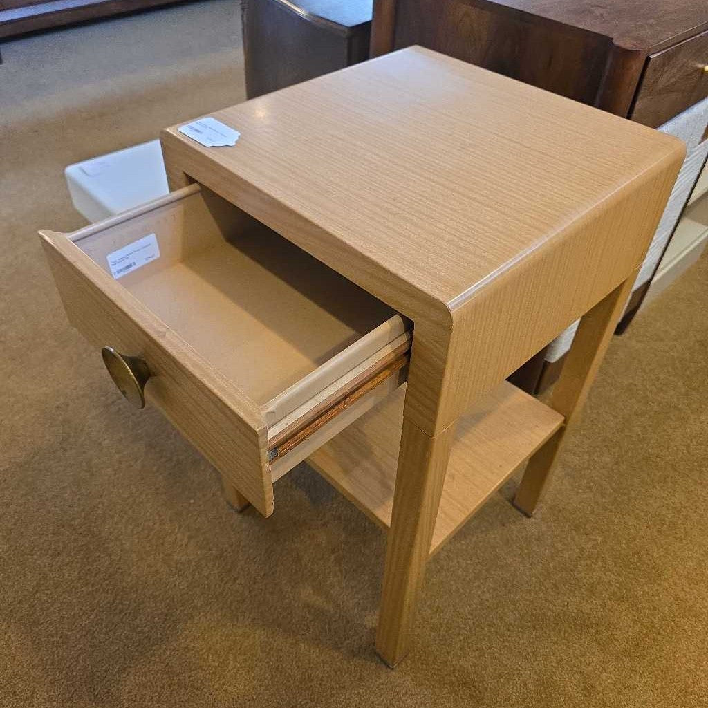 Wooden step stool with an open drawer on a carpeted floor