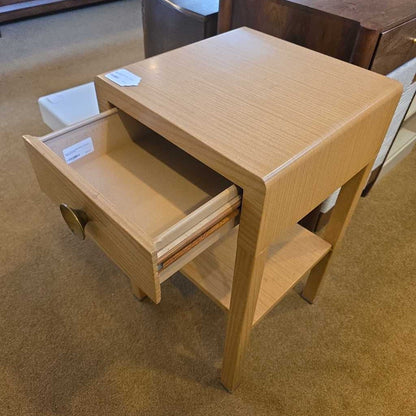 Wooden step stool with an open drawer on a carpeted floor
